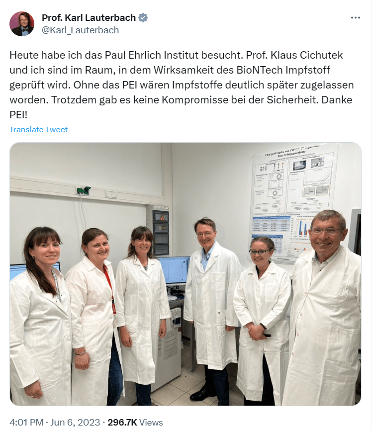 A group of people wearing white coats

Description automatically generated